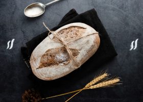 flat-lay-bread-wheat-black-background_23-2148288110